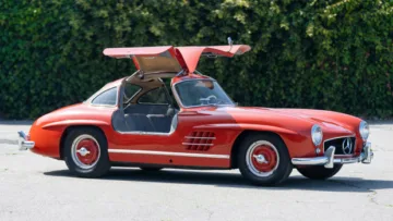 redMercedes-Benz 300 SL Gullwing doors open on offer in the Gooding Geared Online 2020 sale