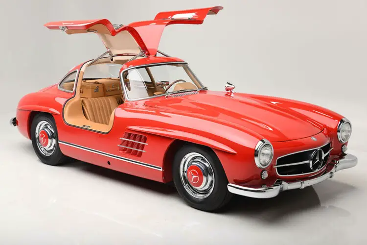 Open doors red 1955 Mercedes-Benz 300SL Gullwing Coupe on sale in the Barrett-Jackson Scottsdale 2022 auction