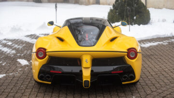 Yellow 2015 Ferrari LaFerrari rear view on sale at the Bonhams Paris 2022 Rétromobile week classic car auction