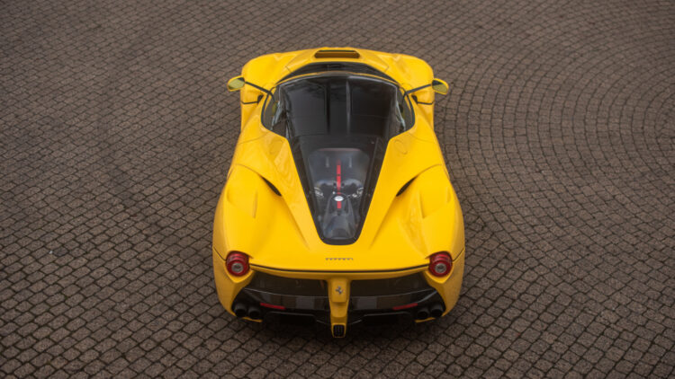 Yellow 2015 Ferrari LaFerrari from above on sale at the Bonhams Paris 2022 Rétromobile week classic car auction