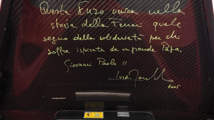 Writing inside the boot lid of the Pope's 2005 Ferrari Enzo