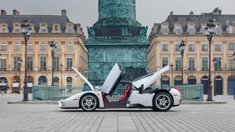 Silver 2004 Ferrari Enzo side profile view with all door and boot and engine cover open on sale RM Sotheby's Monaco auction 2026
