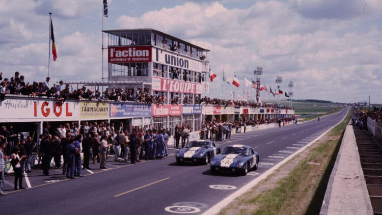 World Champions: CSX2300, wearing race no. 27, and CSX2601, wearing race no. 26, at the FIA GT World Championship at the 12 Hours of Reims on July 4, 1965.